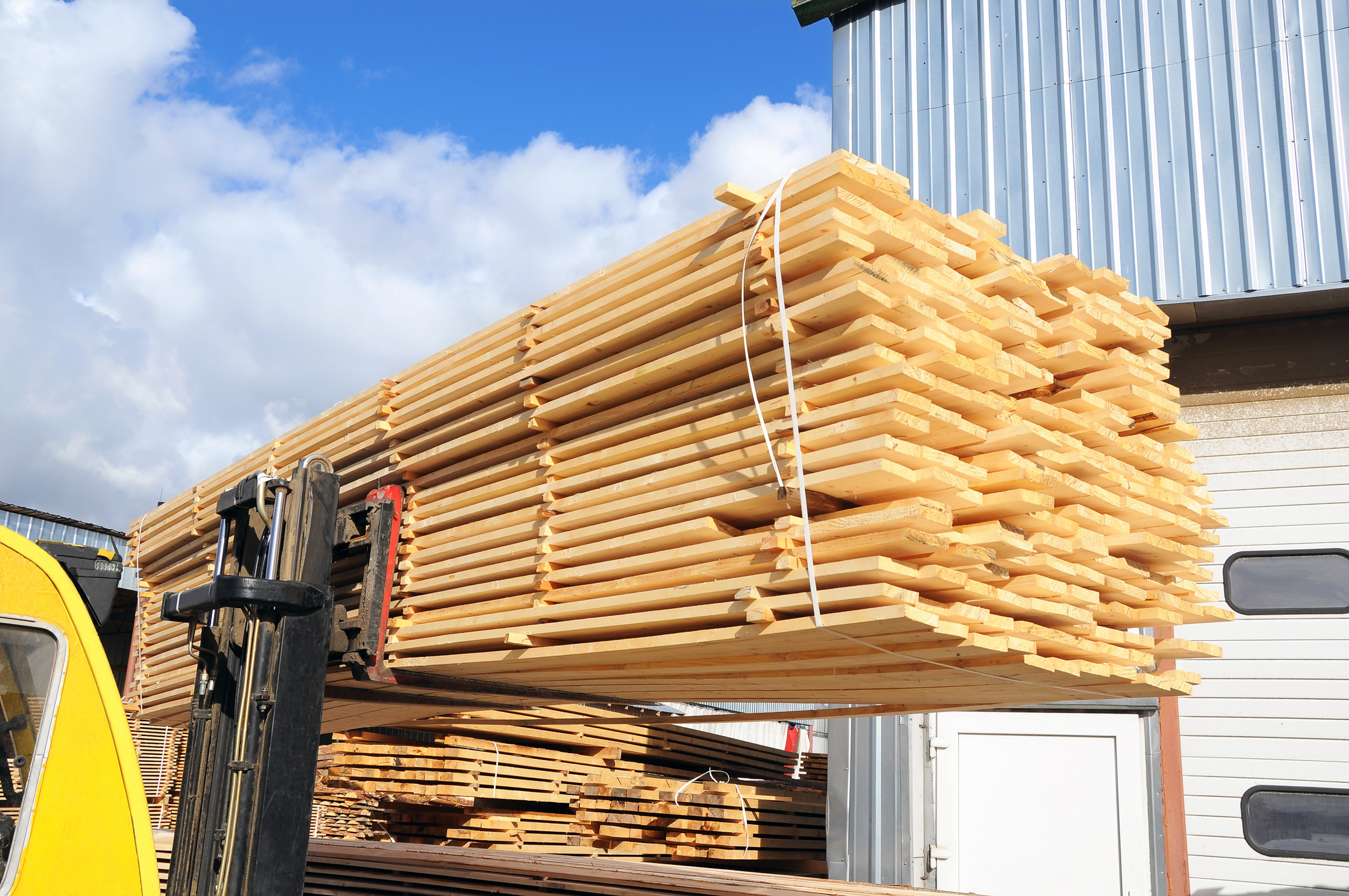 piled up wood ready for transport at a sawmill