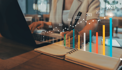 woman on computer with graph showing costs higher in 2025