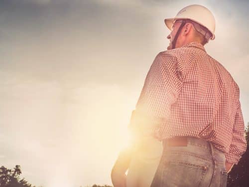 Young engineer in the park. Close-up. Concept of labor and employment