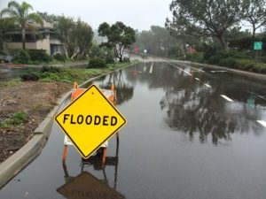 Yellow street sign warns of flooded area