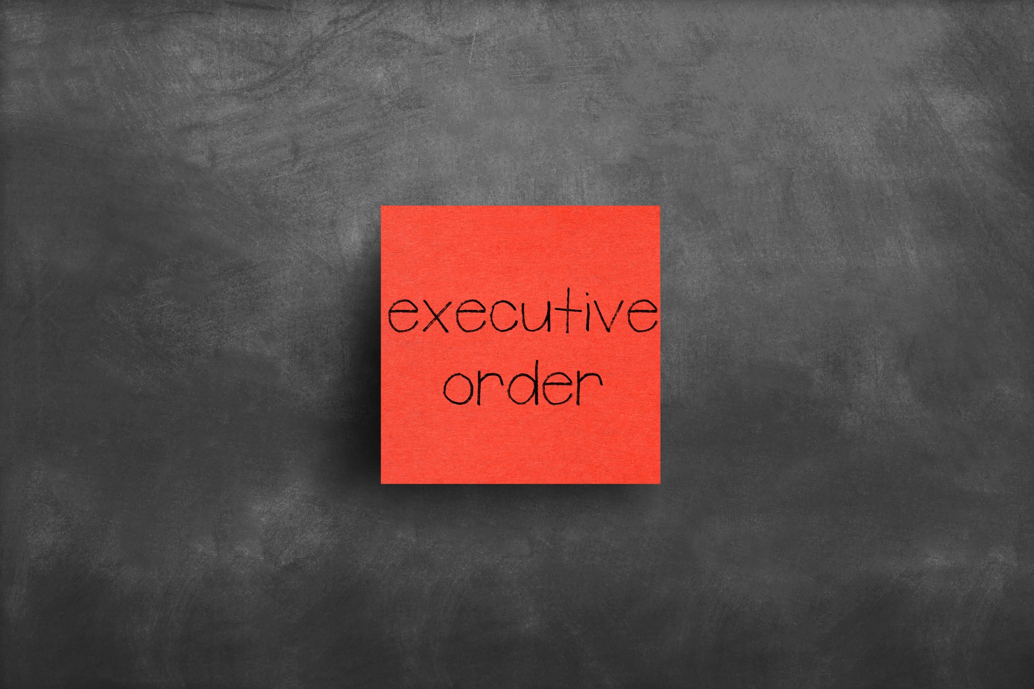 Sticky note on blackboard, Executive order