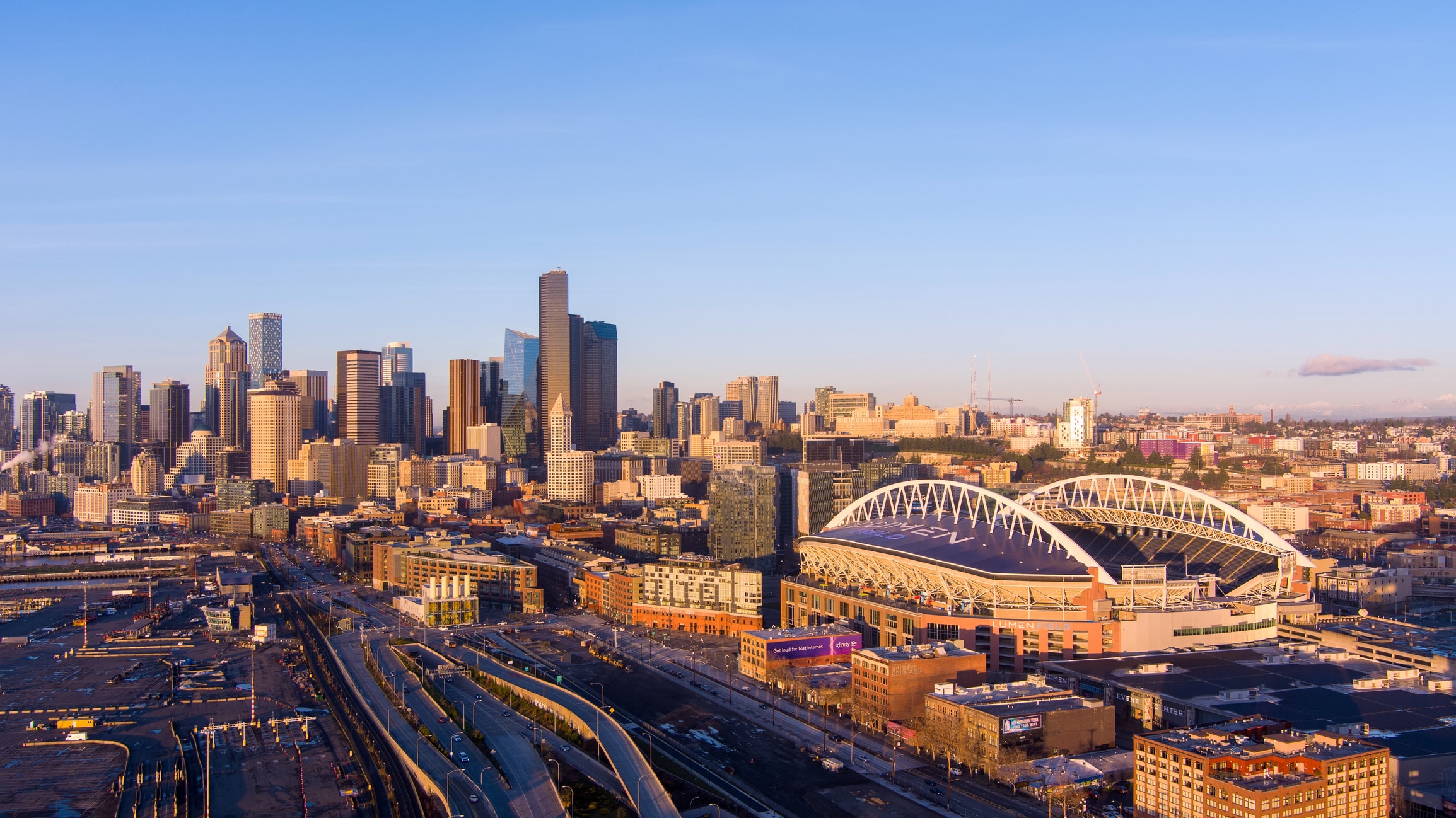 The Seattle, Washington skyline and Lumen Field at sunset in December