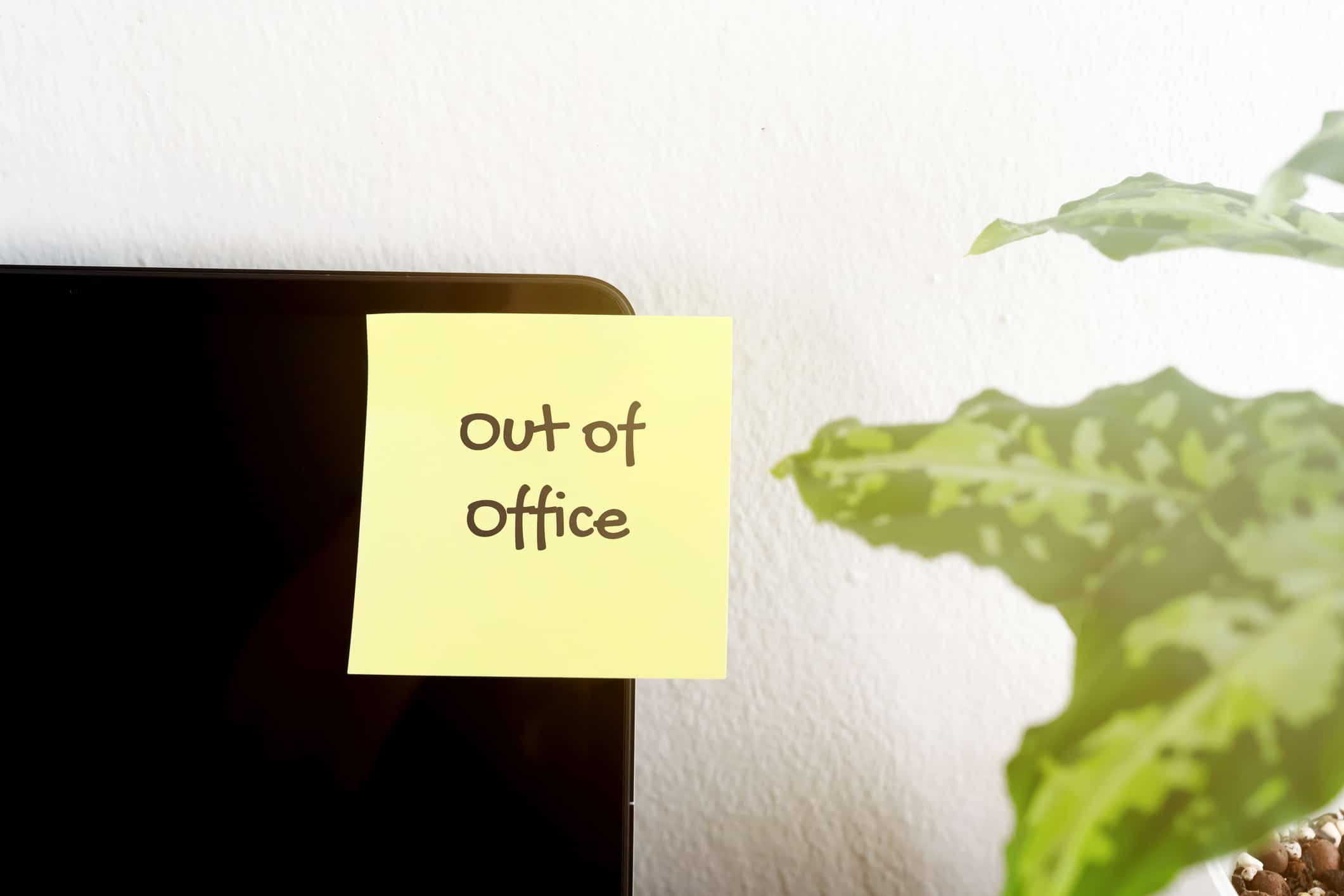 Sticky note with text out of office