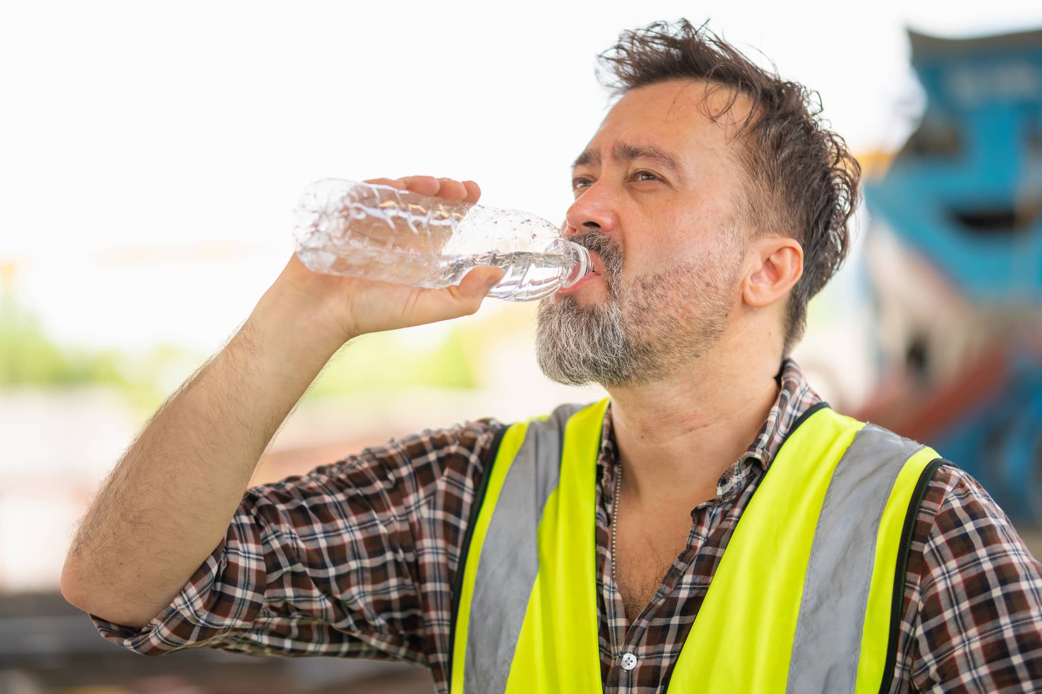 Engineer man drinking water at the precast factory site, Worker man drinking water at construction site