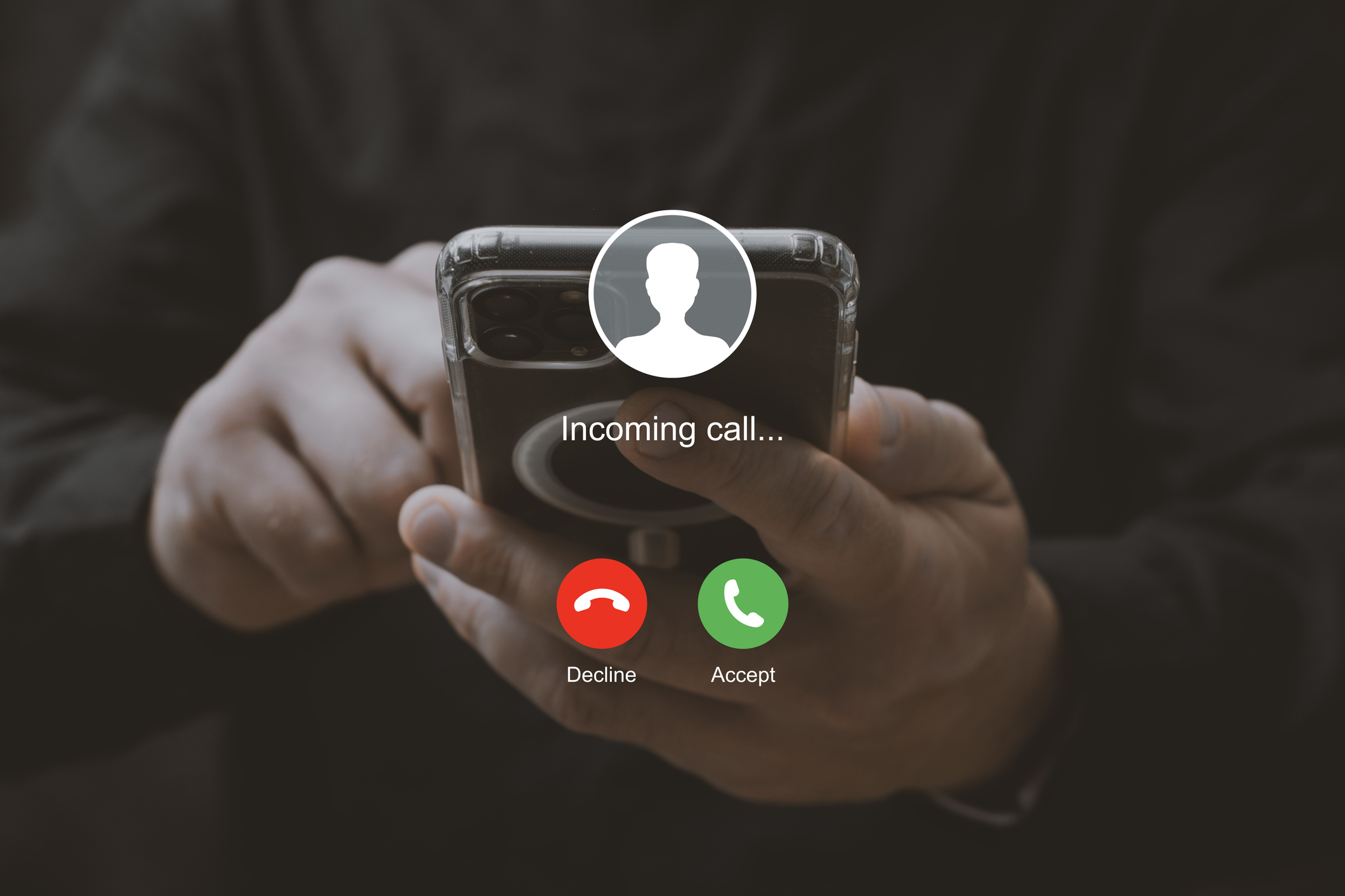 Man holding smartphone with incoming call interface screen. Close-up of hands holding mobile phone with call accept and decline buttons on display