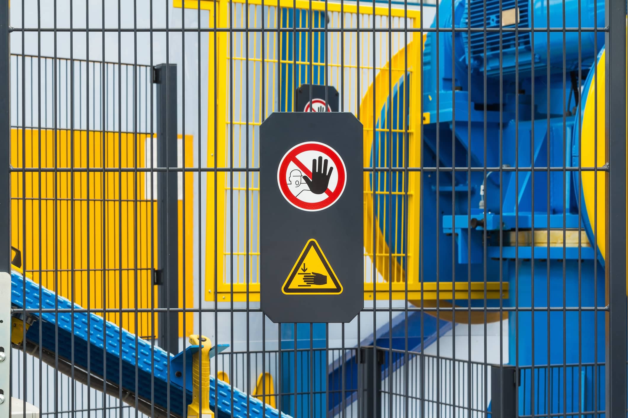 Warning sign for safety on machine, no entry and be careful of hand