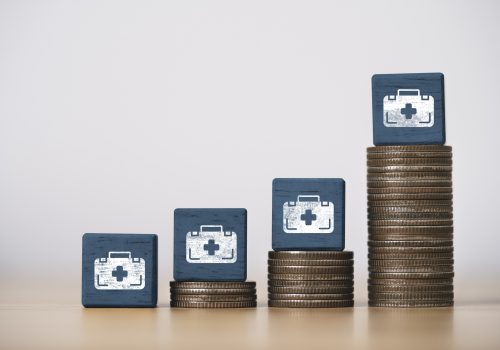 Increasing of coins stacking with medical bag for medical expense and treatment growth from inflation every year