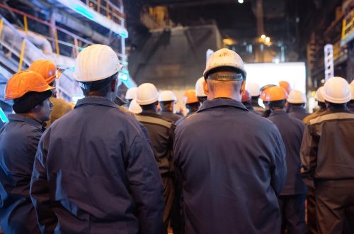 workers in heavy industry getting notified of layoff